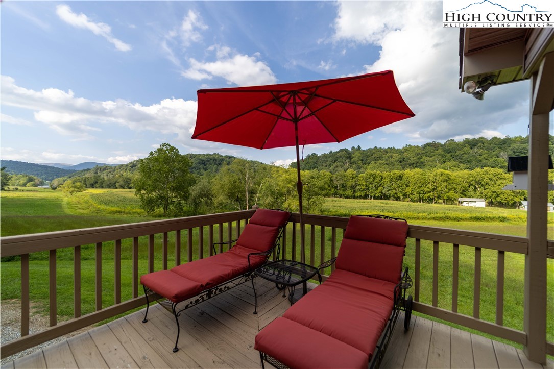 2161 River Bend Road Mouth Of Wilson, VA 24363 - Photo 40 of 47 a view of a deck with furniture and a yard