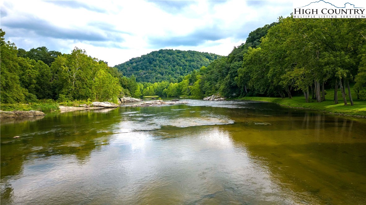 2161 River Bend Road Mouth Of Wilson, VA 24363 - Photo 4 of 47 a view of a lake with houses in the background