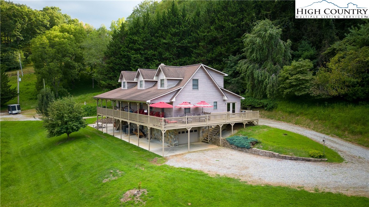 2161 River Bend Road Mouth Of Wilson, VA 24363 - Photo 43 of 47 an aerial view of a house with a garden and deck