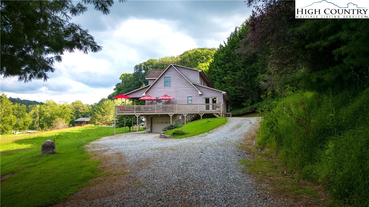 2161 River Bend Road Mouth Of Wilson, VA 24363 - Photo 5 of 47 a view of house with backyard and garden