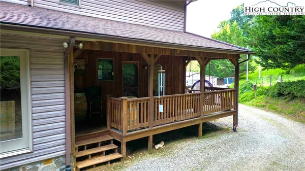 a view of a deck with a table and chairs