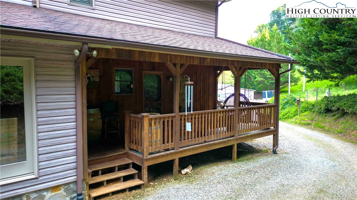 2161 River Bend Road Mouth Of Wilson, VA 24363 - Photo 9 of 47 a view of a deck with a table and chairs