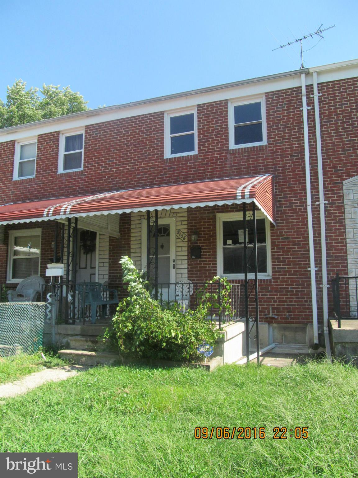 2106 Redthorn Road Baltimore, MD 21220 - Photo 12 of 13 a front view of a house with garden