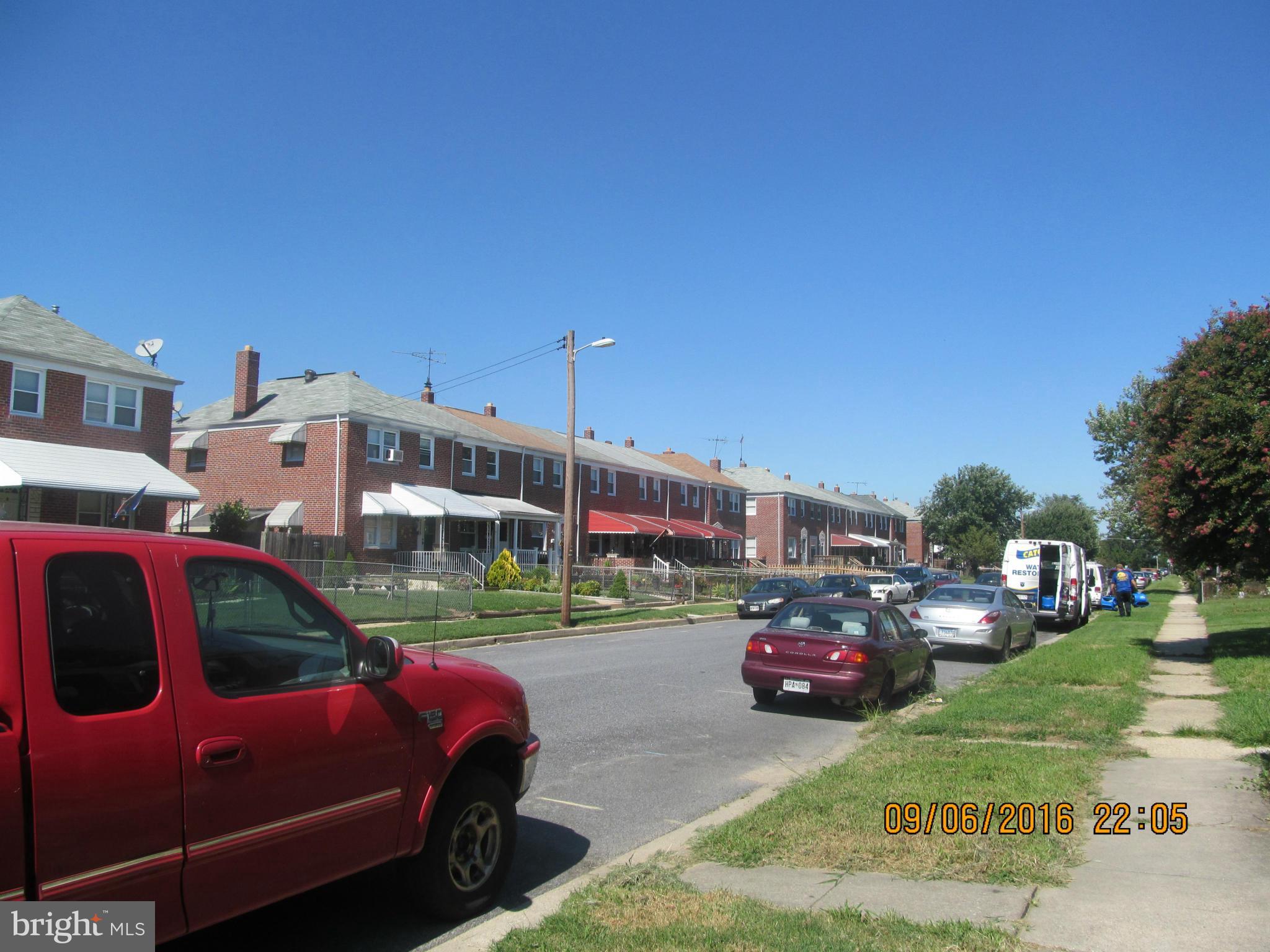 2106 Redthorn Road Baltimore, MD 21220 - Photo 13 of 13 a front view of a building with cars parked