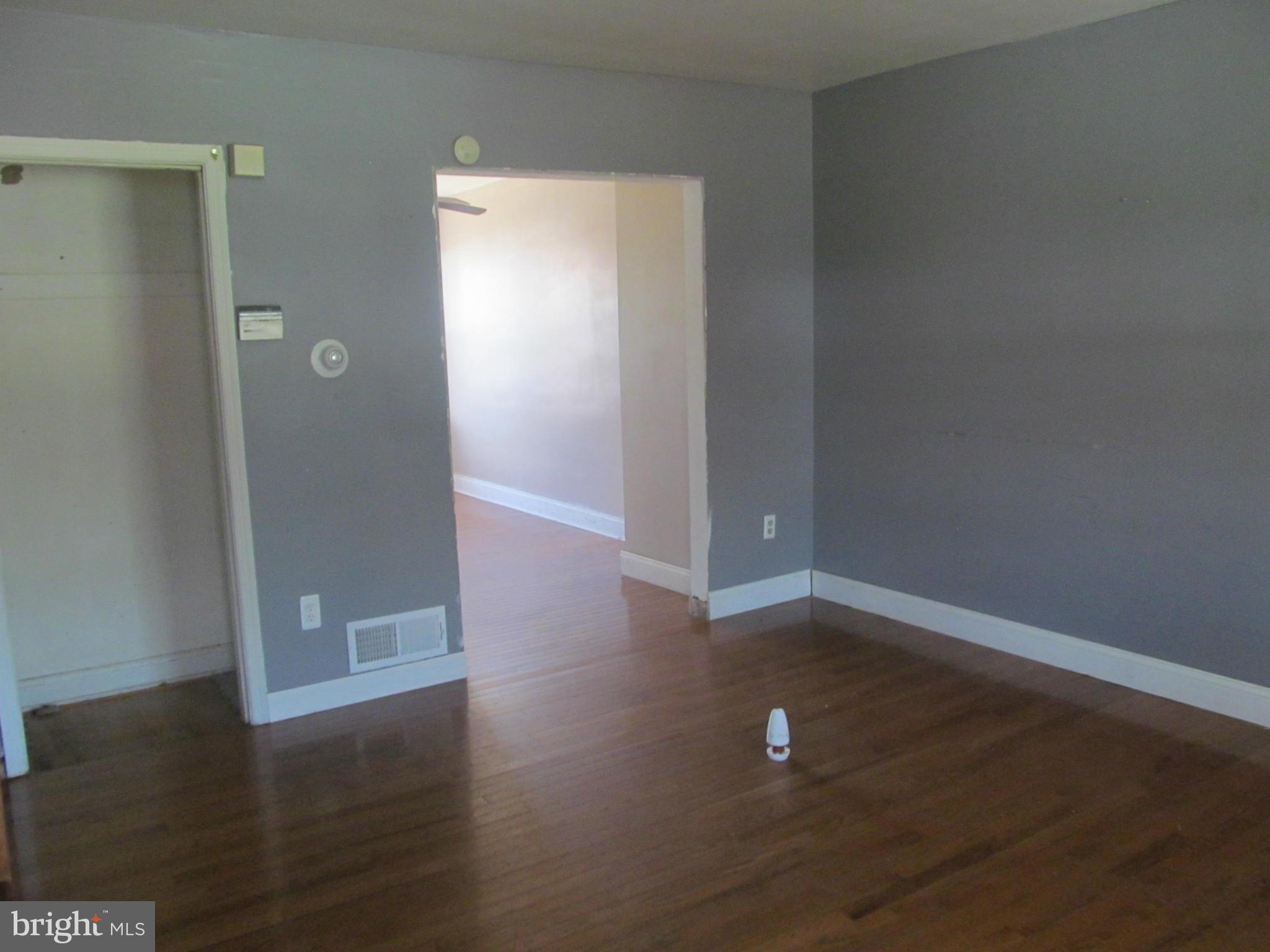 2106 Redthorn Road Baltimore, MD 21220 - Photo 2 of 13 an empty room with wooden floor and closet