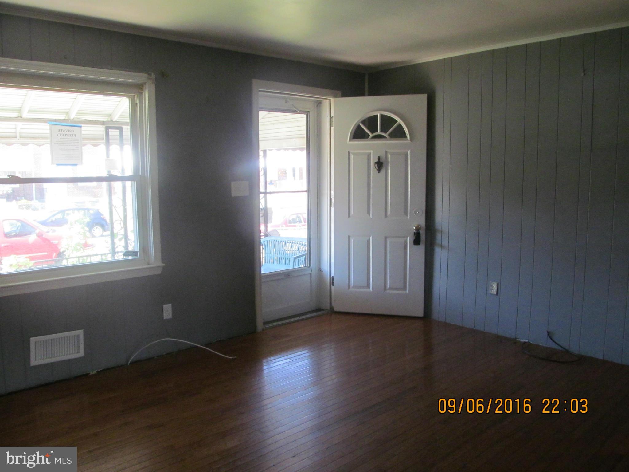 2106 Redthorn Road Baltimore, MD 21220 - Photo 6 of 13 a view of a livingroom with wooden floor and a window