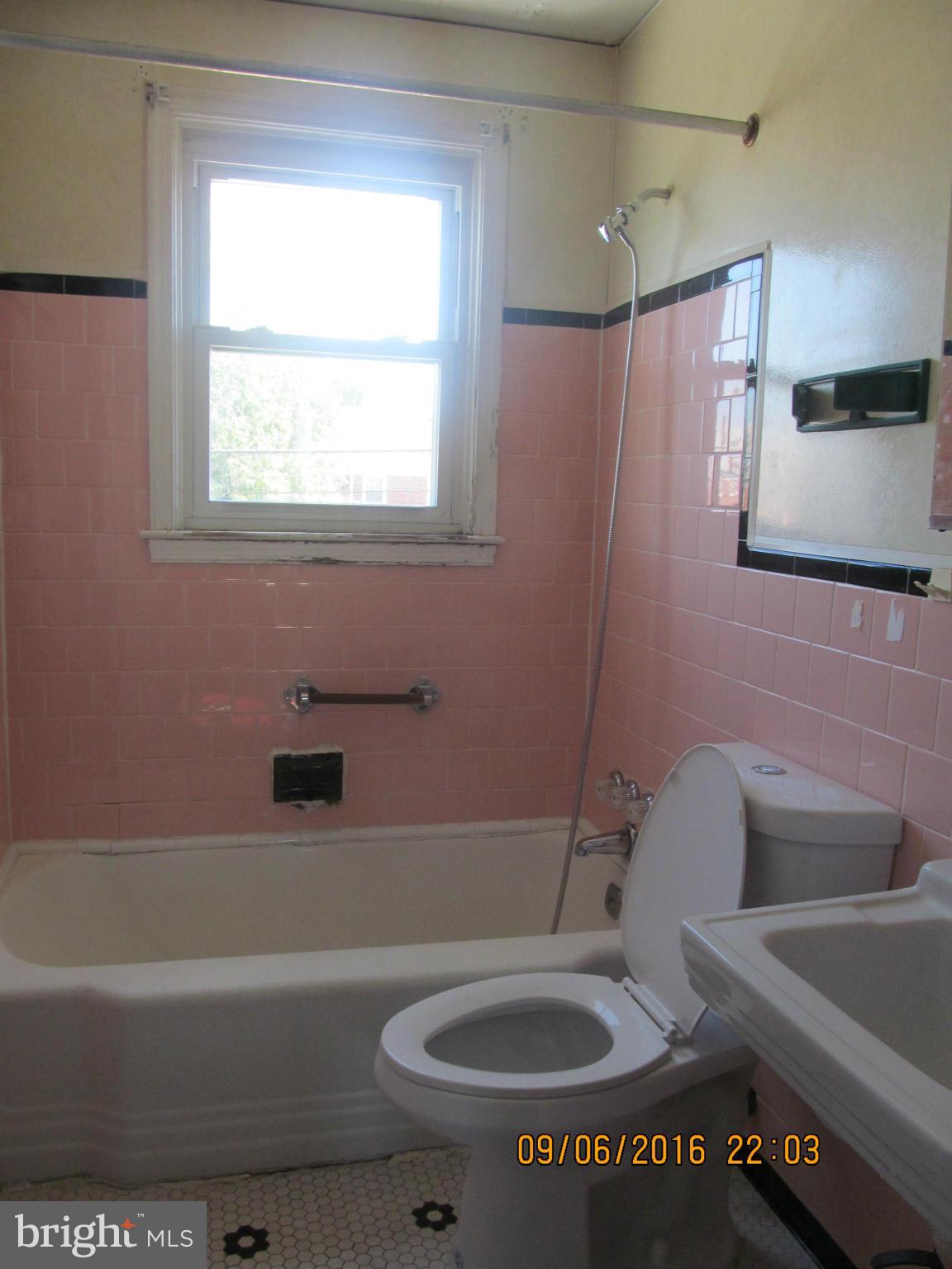 2106 Redthorn Road Baltimore, MD 21220 - Photo 7 of 13 a bathroom with a sink a toilet and bathtub