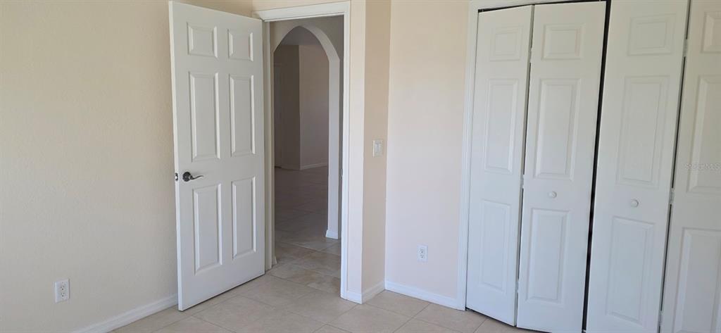 26201 Explorer Road, Unit 5 Punta Gorda, FL 33983 - Photo 7 of 11 a view of a bathroom from the hallway