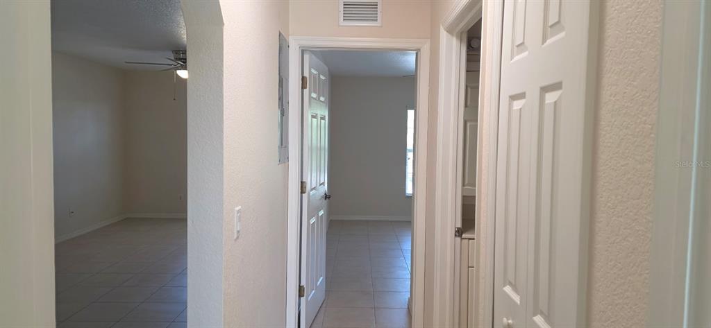 26201 Explorer Road, Unit 5 Punta Gorda, FL 33983 - Photo 8 of 11 a view of a bathroom from a corridor