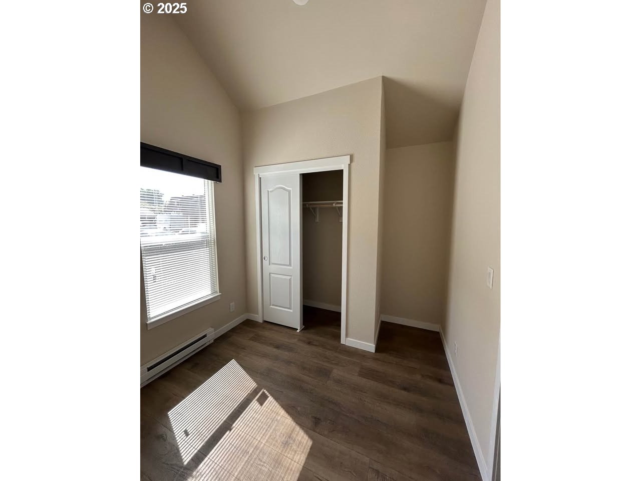 4130 State Street, Unit 9 Salem, OR 97301 - Photo 11 of 14 a view of an empty room with wooden floor and a window