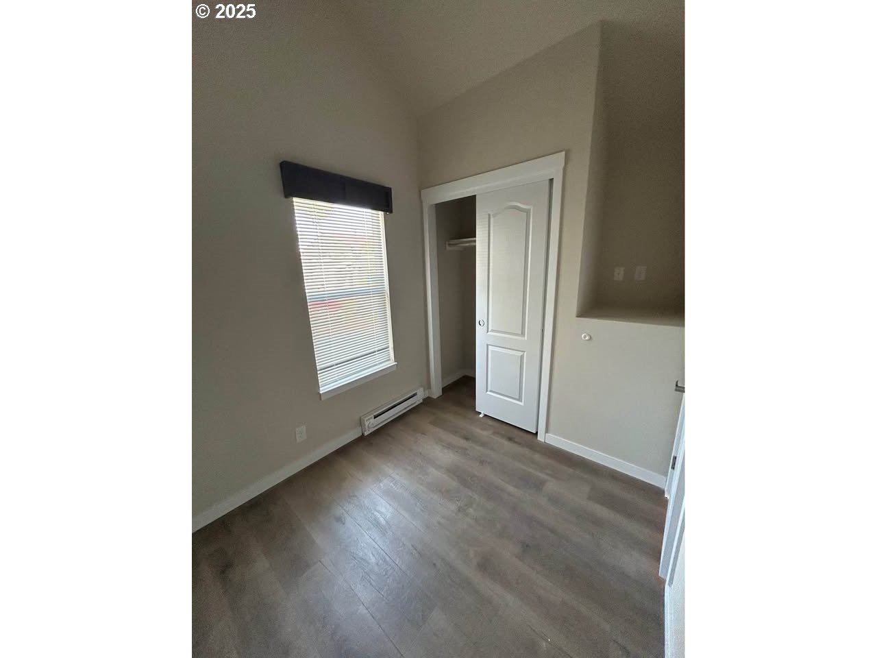 4130 State Street, Unit 9 Salem, OR 97301 - Photo 13 of 14 a view of an empty room with wooden floor
