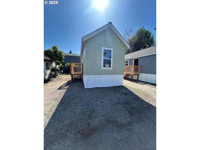 a view of a house with a yard and garage