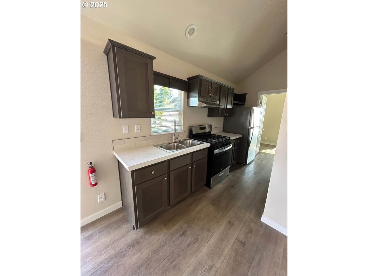 4130 State Street, Unit 9 Salem, OR 97301 - Photo 5 of 14 a kitchen with stainless steel appliances a sink and a stove