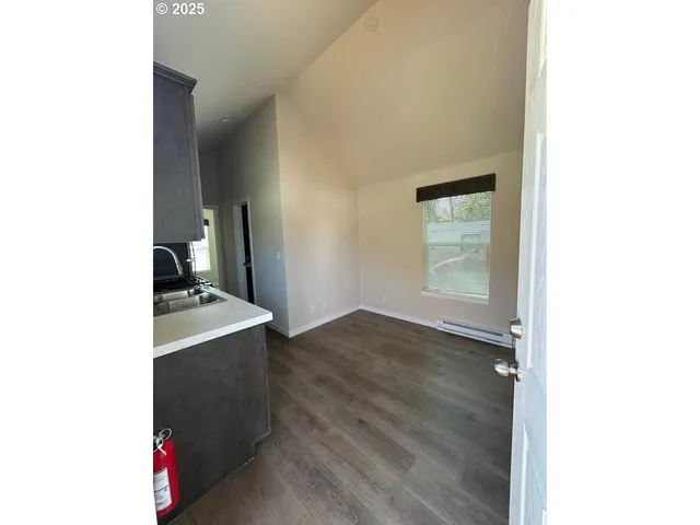 a kitchen with a sink and a stove