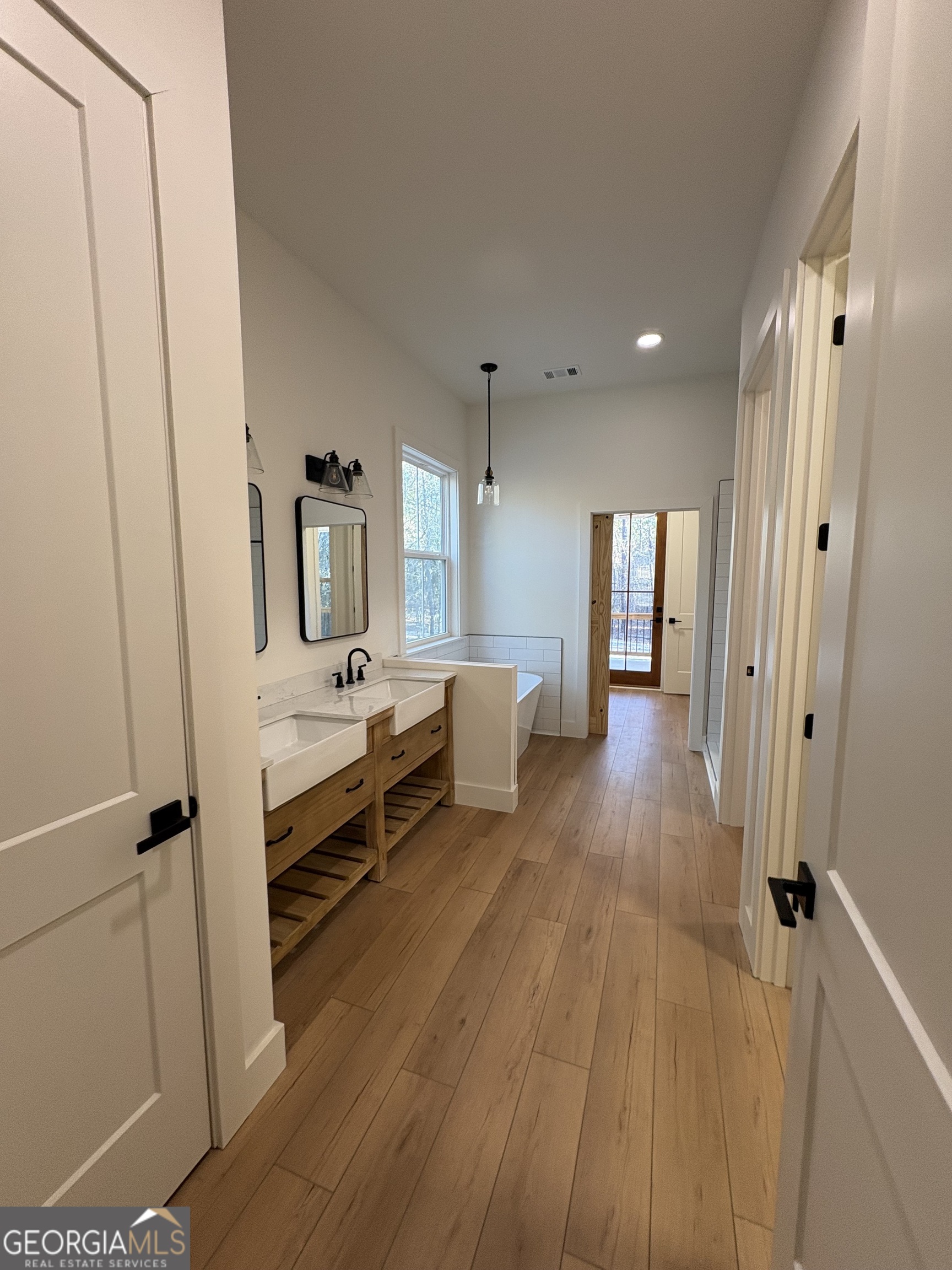 435 Muskogee Trail Dublin, GA 31021 - Photo 15 of 31 a bathroom with sink and mirror