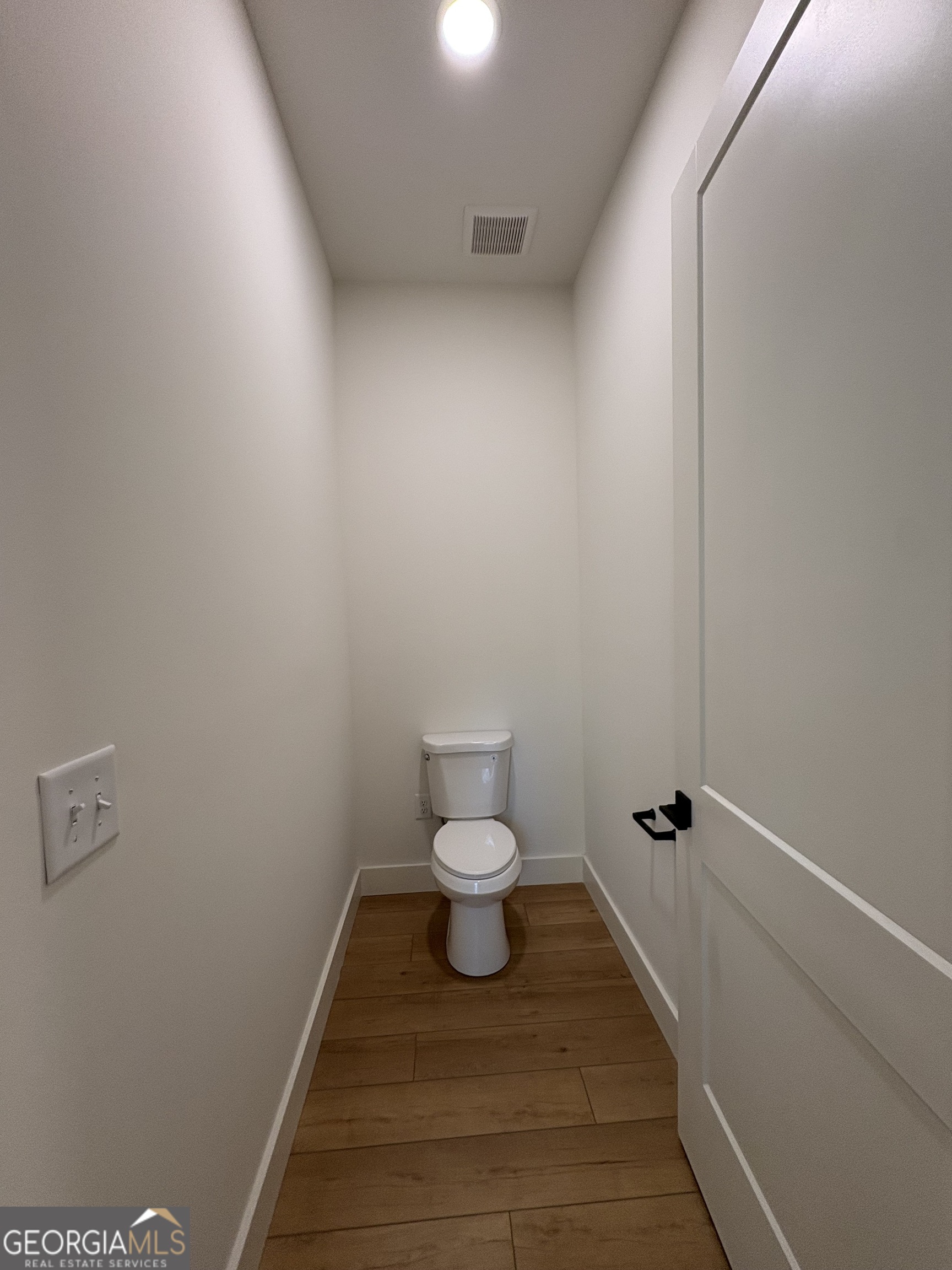 435 Muskogee Trail Dublin, GA 31021 - Photo 16 of 31 a bathroom with a toilet and a shower