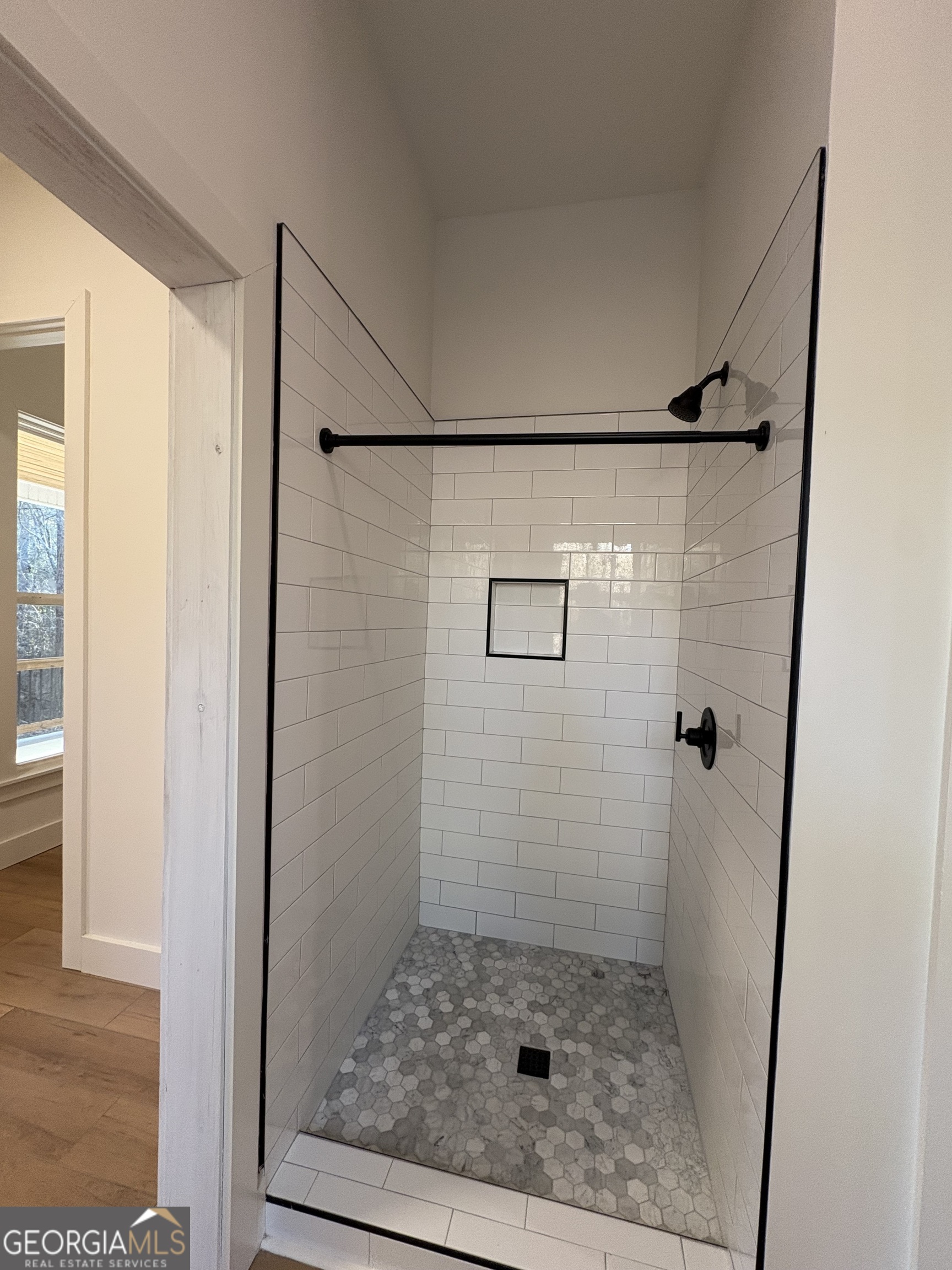 435 Muskogee Trail Dublin, GA 31021 - Photo 17 of 31 a bathroom with a granite countertop shower