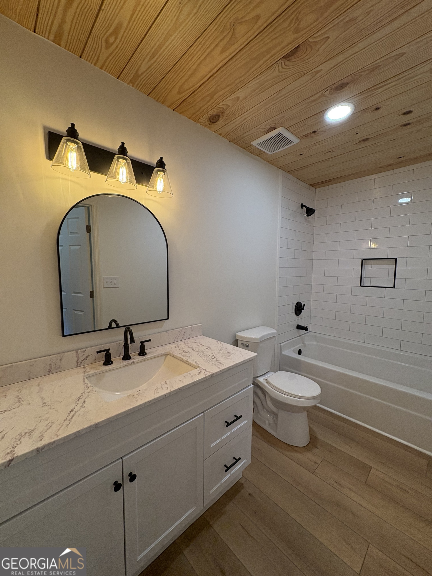 435 Muskogee Trail Dublin, GA 31021 - Photo 23 of 31 a bathroom with a toilet sink and mirror
