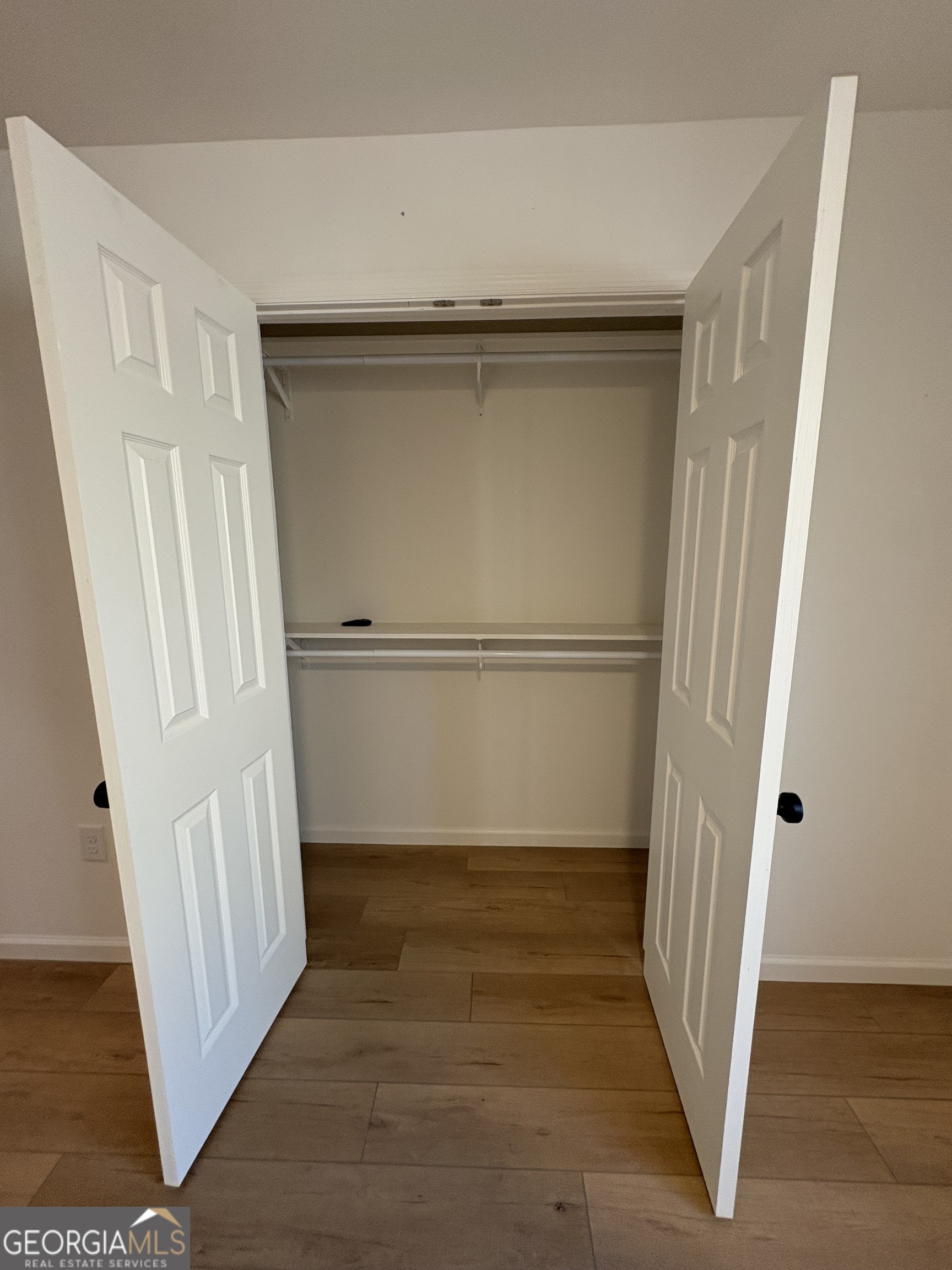 435 Muskogee Trail Dublin, GA 31021 - Photo 27 of 31 an empty room with wooden floor and entrance