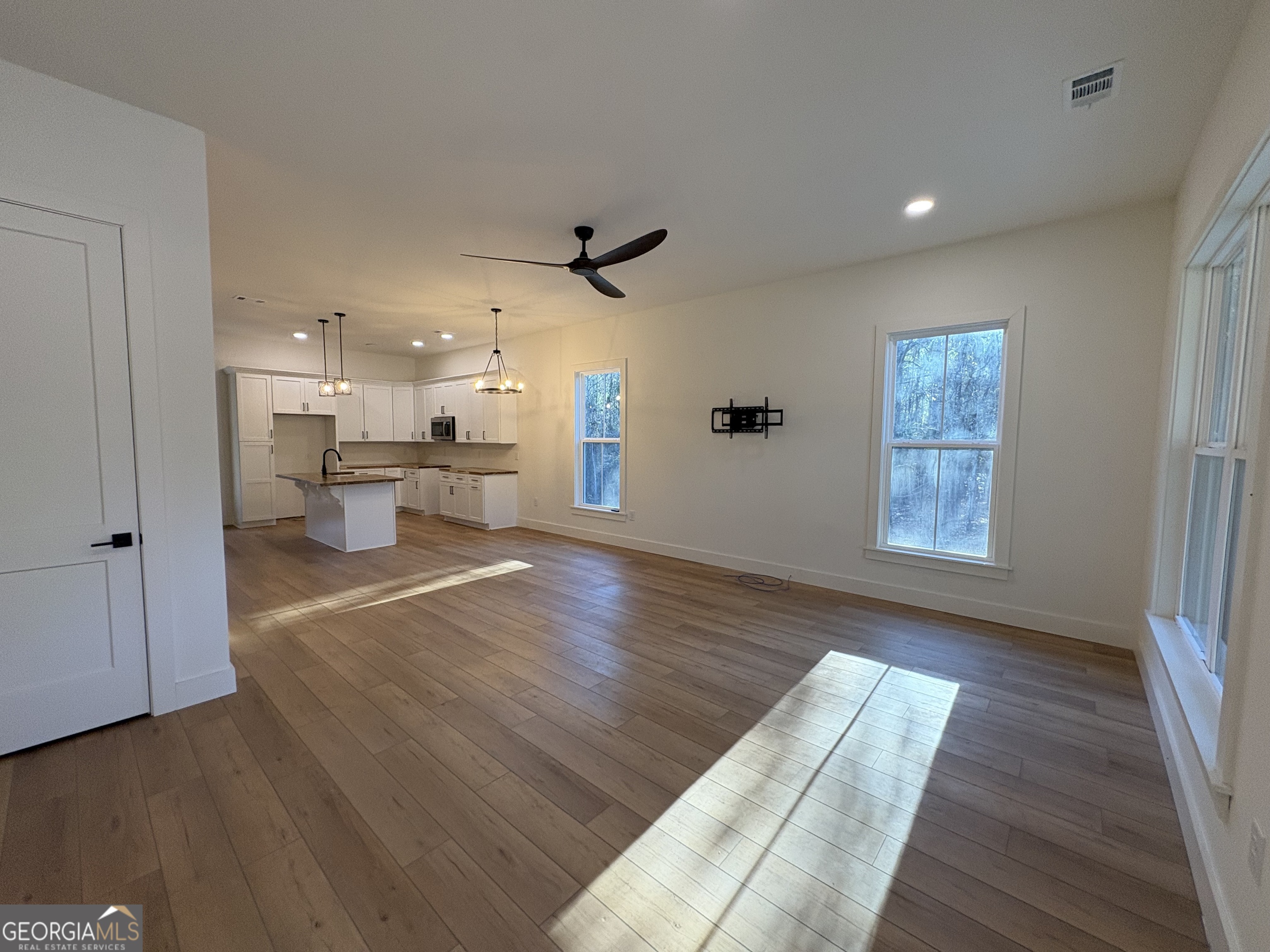 435 Muskogee Trail Dublin, GA 31021 - Photo 5 of 31 a view of a living room with wooden floor and a window