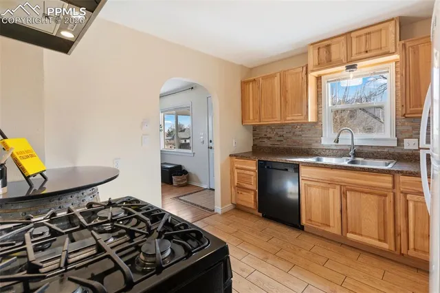 a kitchen with a stove and a sink