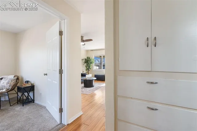 a view of a hallway and closet