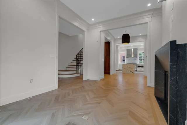 a view of a kitchen with a refrigerator and a stove