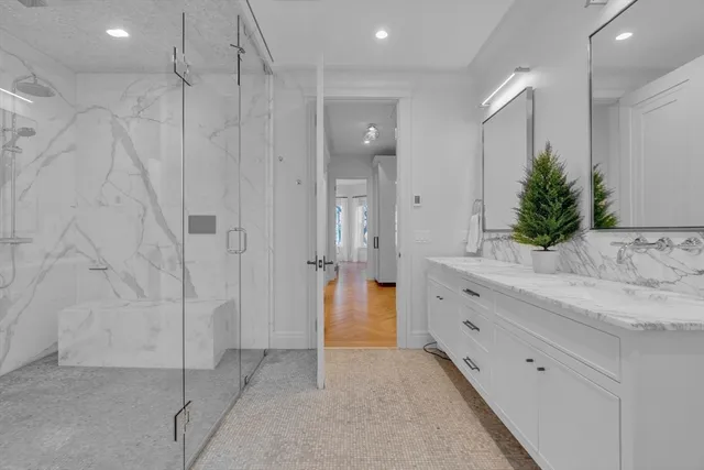a bathroom with a shower and a sink