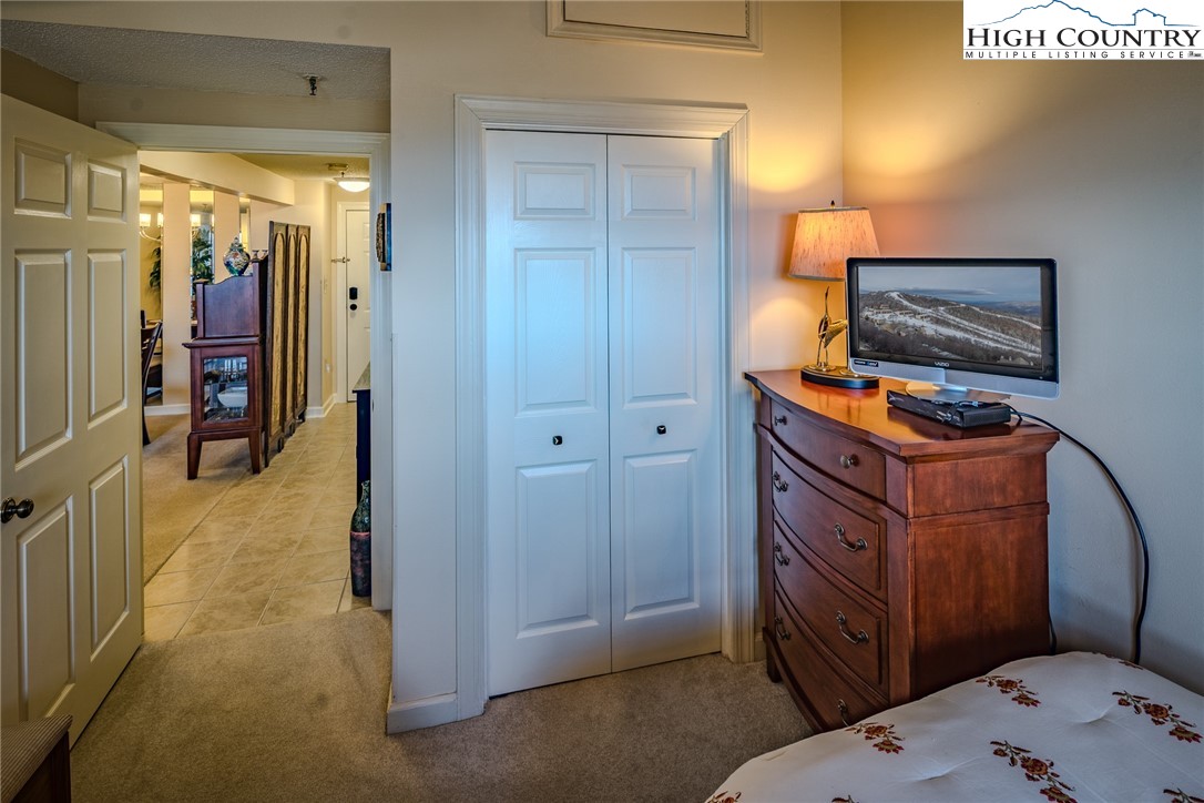 303 Sugar Top Drive, Unit 43427 Sugar Mountain, NC 28604 - Photo 16 of 18 a view of a bedroom with workspace and bedroom