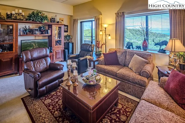 a living room with furniture and a rug