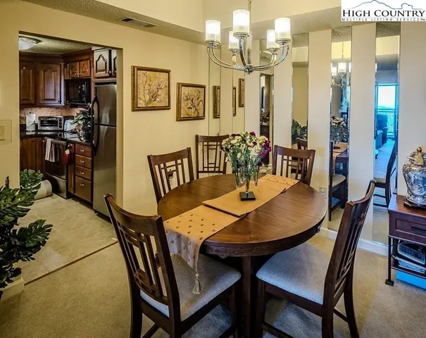 a kitchen with stainless steel appliances granite countertop a stove top oven a sink and dishwasher