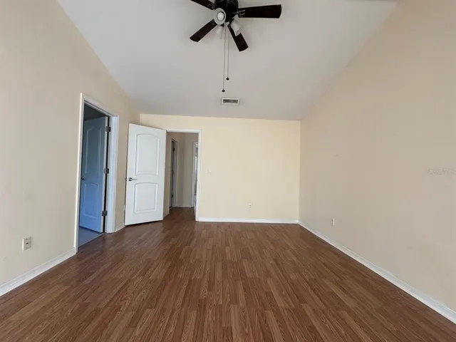 a view of room with wooden floor