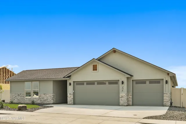 a kitchen with sink a stove and cabinets