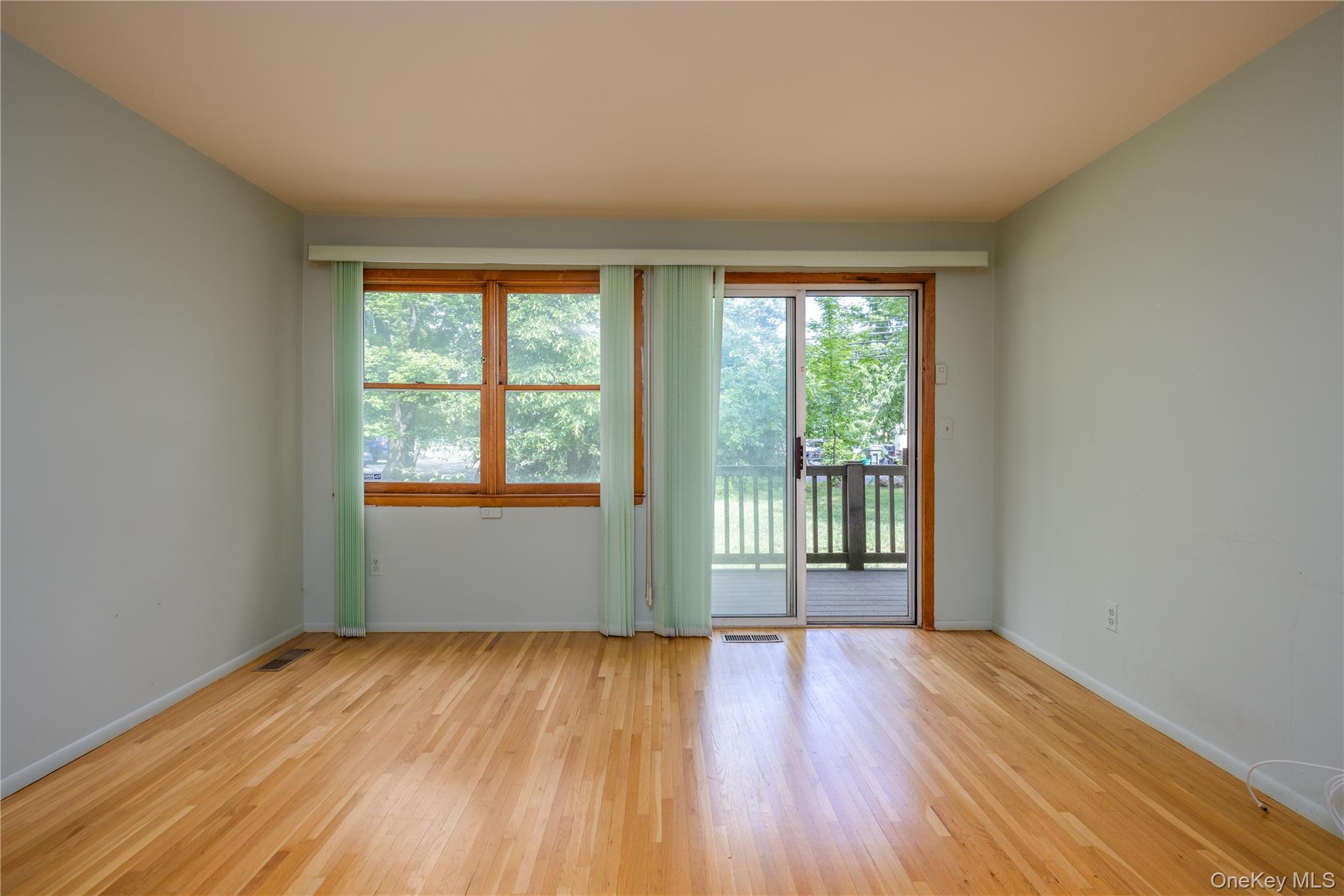 135 West Nyack Road, Unit 93 Nanuet, NY 10954 - Photo 8 of 17 Sliding doors leading to deck
