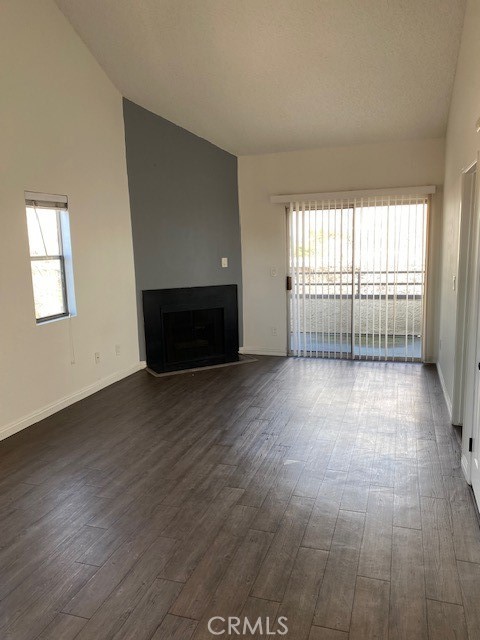 440 West 5th Street, Unit 305 Long Beach, CA 90802 - Photo 11 of 20 an empty room with wooden floor and windows