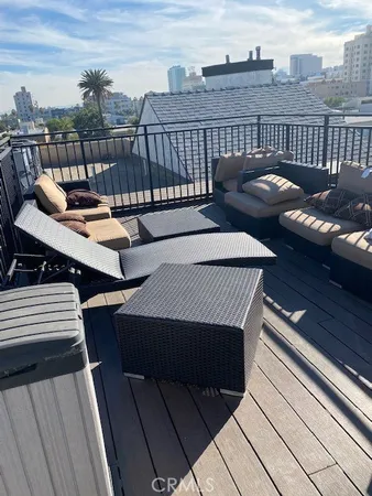 a view of a roof deck with couches
