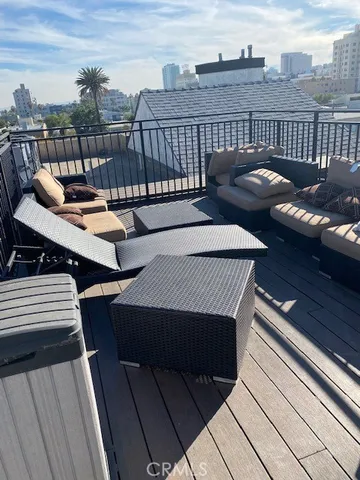 a view of a roof deck with couches