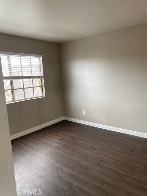 440 West 5th Street, Unit 305 Long Beach, CA 90802 - Photo 5 of 20 an empty room with wooden floor and windows