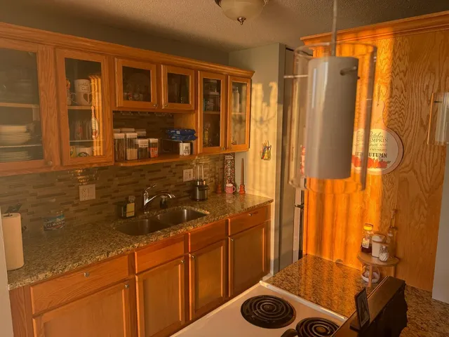 a view of a dining room with furniture and window