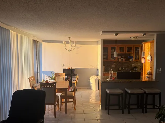 a kitchen with a refrigerator and a sink