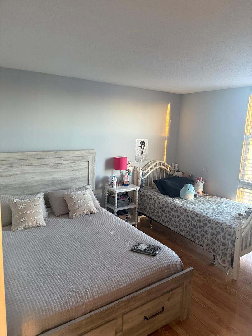 1043 South York Road, Unit 411 Bensenville, IL 60106 - Photo 19 of 31 a bedroom with two beds and dresser