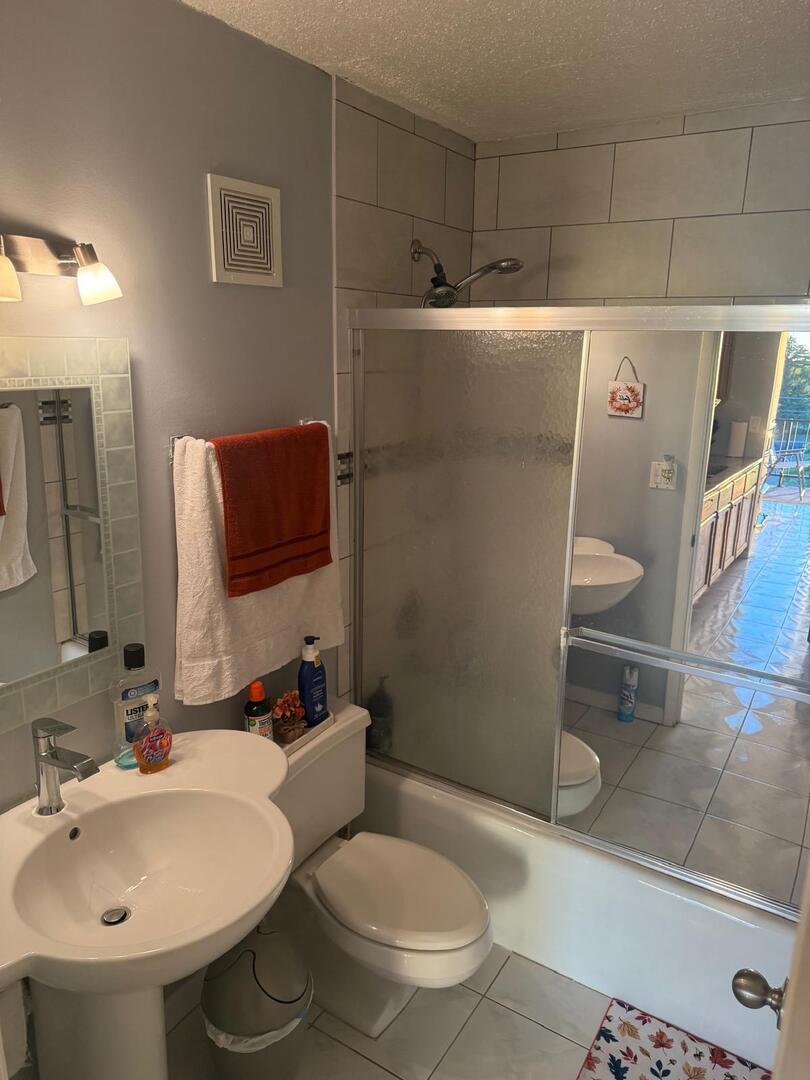 1043 South York Road, Unit 411 Bensenville, IL 60106 - Photo 22 of 31 a bathroom with a sink toilet and shower