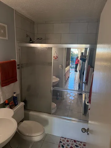 a bathroom with a toilet and a sink