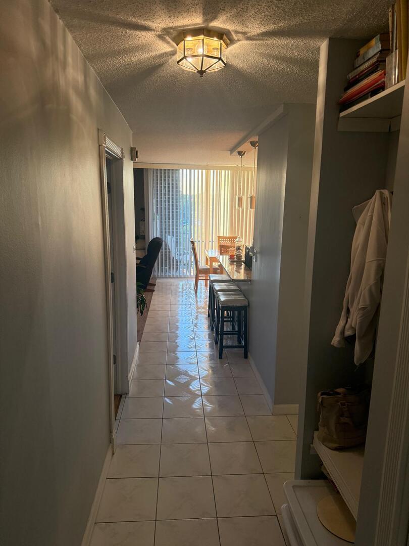 1043 South York Road, Unit 411 Bensenville, IL 60106 - Photo 4 of 31 a view of a hallway with seating area