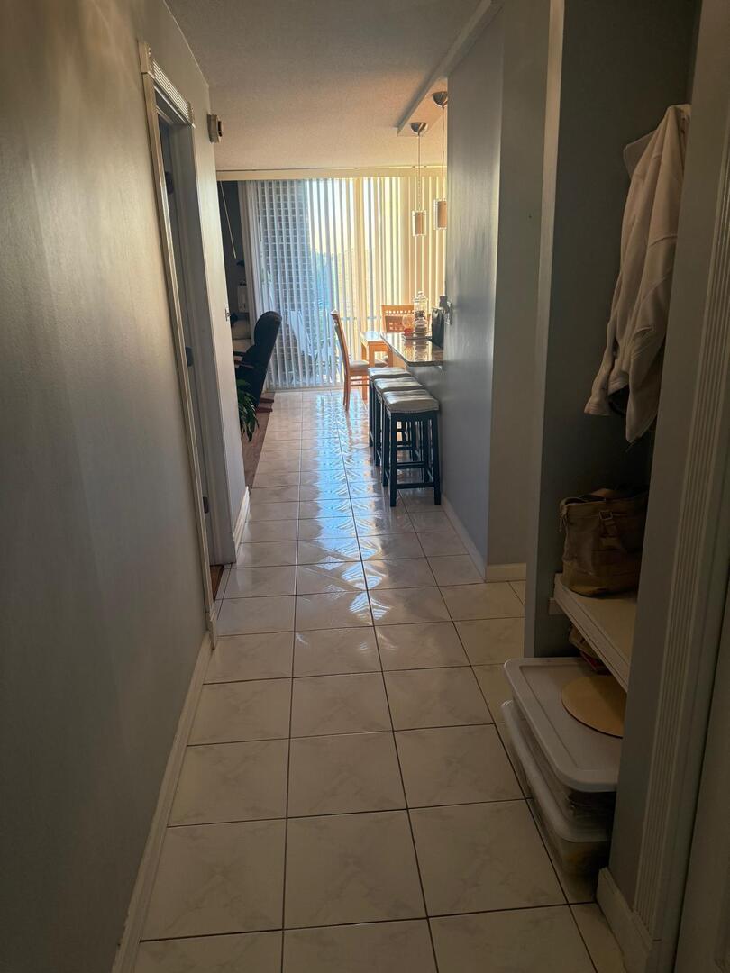 1043 South York Road, Unit 411 Bensenville, IL 60106 - Photo 5 of 31 a room with washing machine and chair