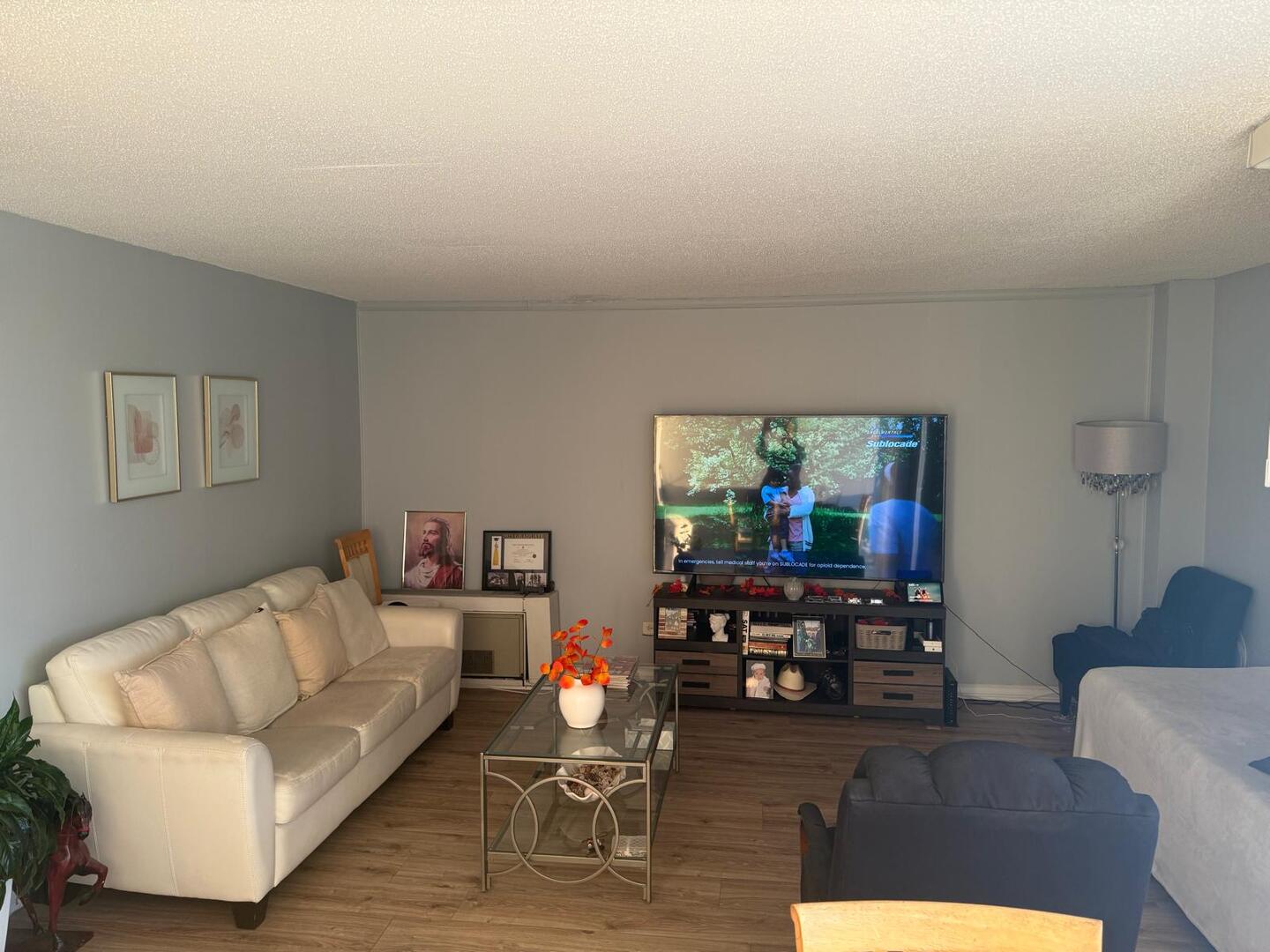 1043 South York Road, Unit 411 Bensenville, IL 60106 - Photo 7 of 31 a living room with furniture and a large window