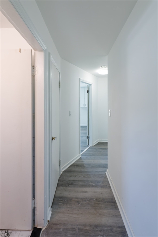 1 Rockland Rd Court Auburn, MA 01501 - Photo 22 of 38 a view of a hallway with wooden floor and staircase