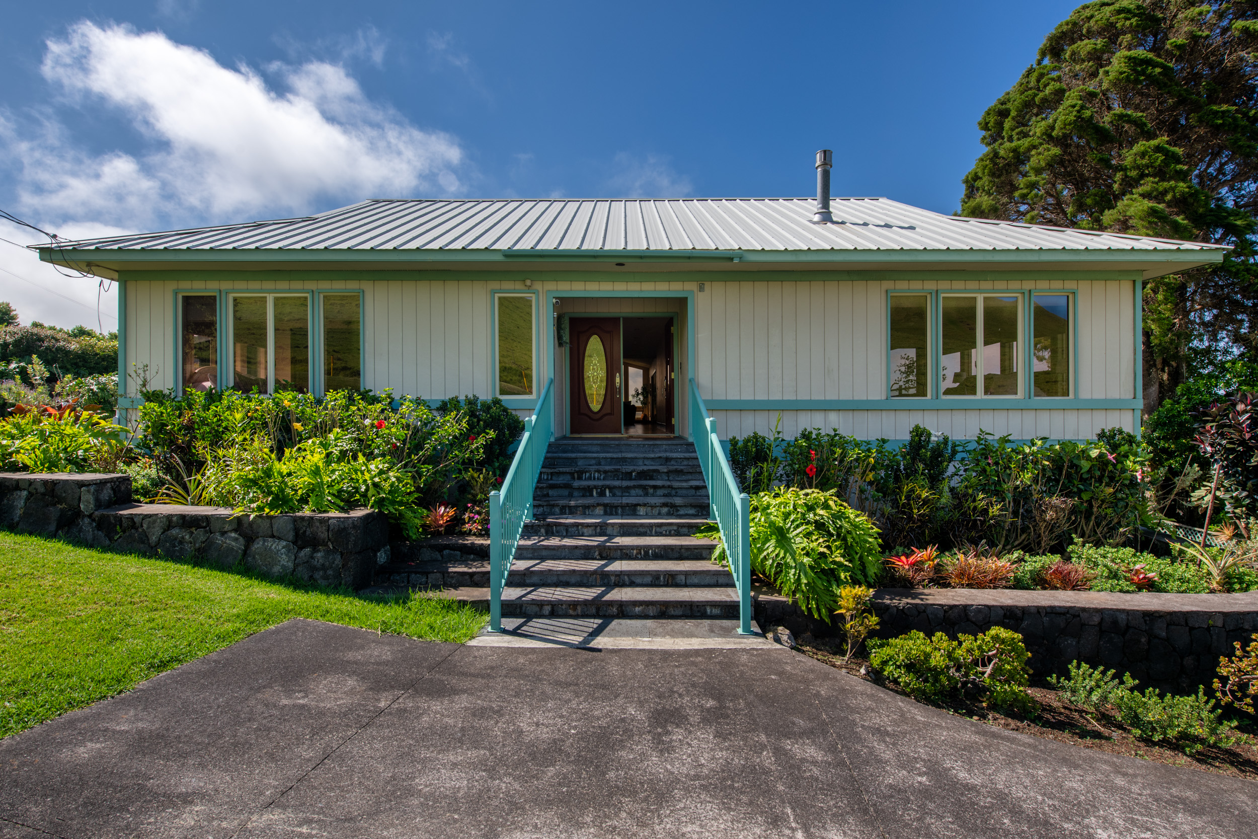 65-1310 Lihipali Road, Unit B Kamuela, HI 96743 - Photo 2 of 19 a front view of a house with a yard