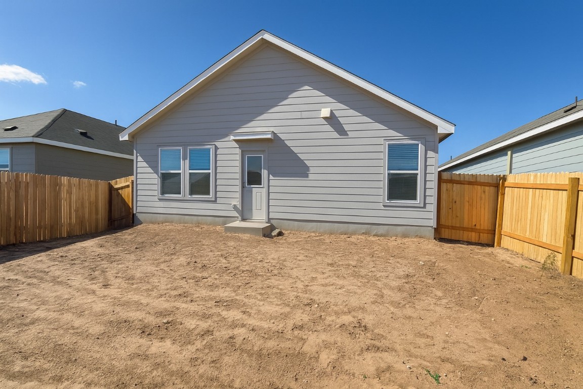 461 Whoopers Loop Uhland, TX 78640 - Photo 10 of 12 a backyard of a house