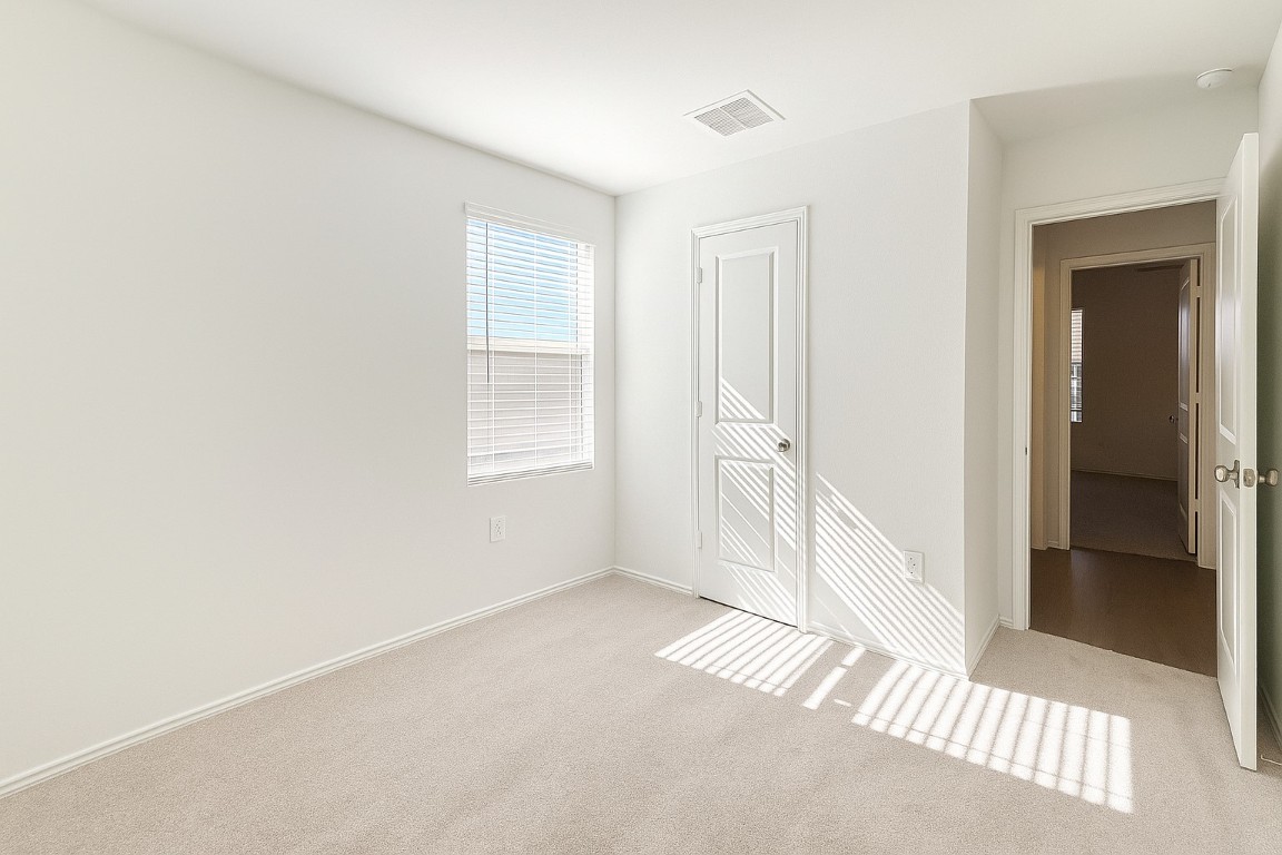 461 Whoopers Loop Uhland, TX 78640 - Photo 4 of 12 an empty room with windows